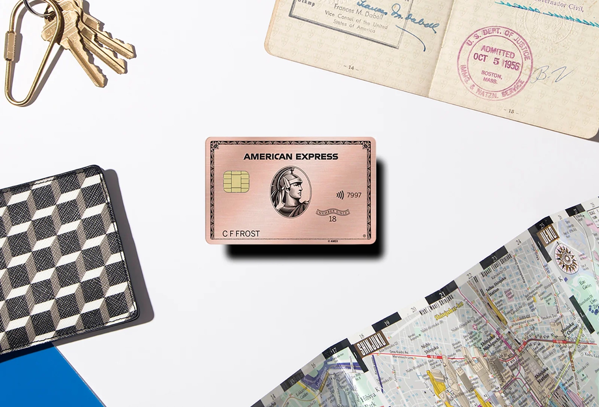 The Rose Gold American Express Card with travel accessories