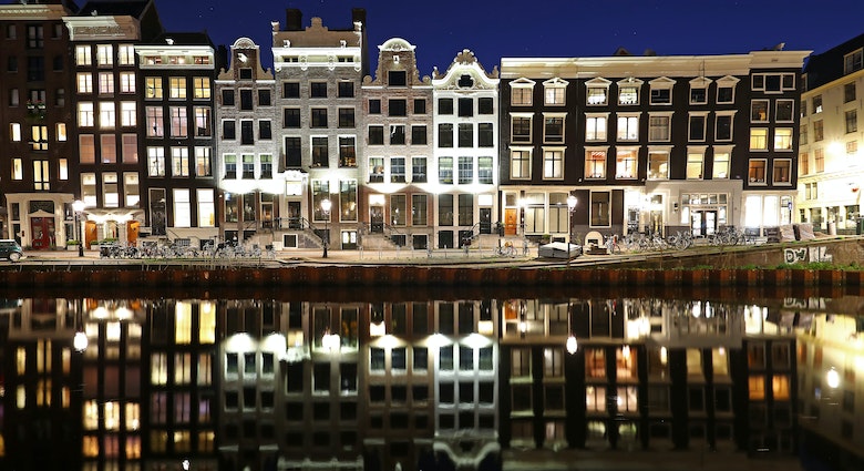 AMSTERDAM, NETHERLANDS - APRIL 04:  A general view of houses near the "Red Light District" which comes from the red neon lights that highlight the windows where prostitution is legal, but the area is also famous for its canals, coffeeshops selling marijuana or cannabis, brothels, sex shops and museums on what would be a usually busy Saturday night on April 04, 2020 in Amsterdam, Netherlands. All non-essential businesses will follow national policy regarding the coronavirus (COVID-19) due to precautionary measures and will be closed to the public at least until further notice.  The Coronavirus (COVID-19) pandemic has spread to many countries across the world, claiming over 60,000 lives and infecting hundreds of thousands more. (Photo by Dean Mouhtaropoulos/Getty Images)
1217135211
bestof, topix