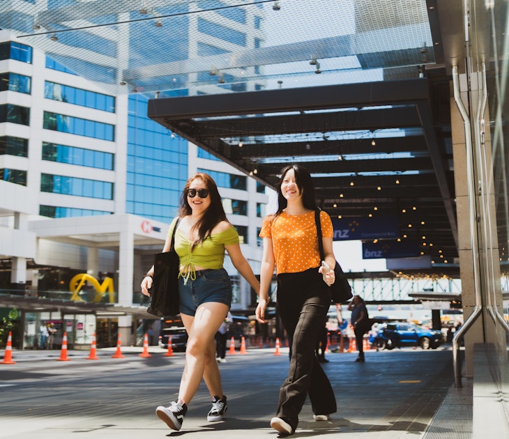 Two friends walking through the city. - stock photo
The portrait of two happy confident women very excited and walking through the city.