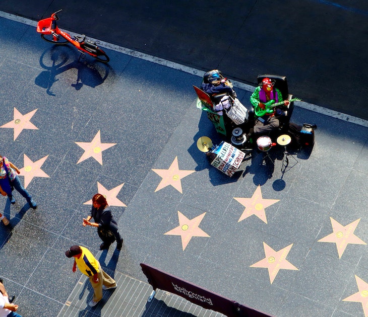 October 10, 2019: High-angle view of the Hollywood Boulevard walk of fame, as seen from the Hollywood & Highland entertainment center Dolby Theatre rooftop terrace.
1559045450
actor, actress, america, avenue, blvd, boulevard, building, california, cars, celebrity, cinema, city, county, dolby theatre, downtown, entertainment, fame, famous, film, glamour, highland, hollywood, landmark, los angeles, media, movie, music, oscar, outside, pedestrians, place, producer, shops, singer, star, starline, street, strip, sunset, theater, theatre, tile, tourism, tourist, traffic, urban, usa, view, walk, walk of fame